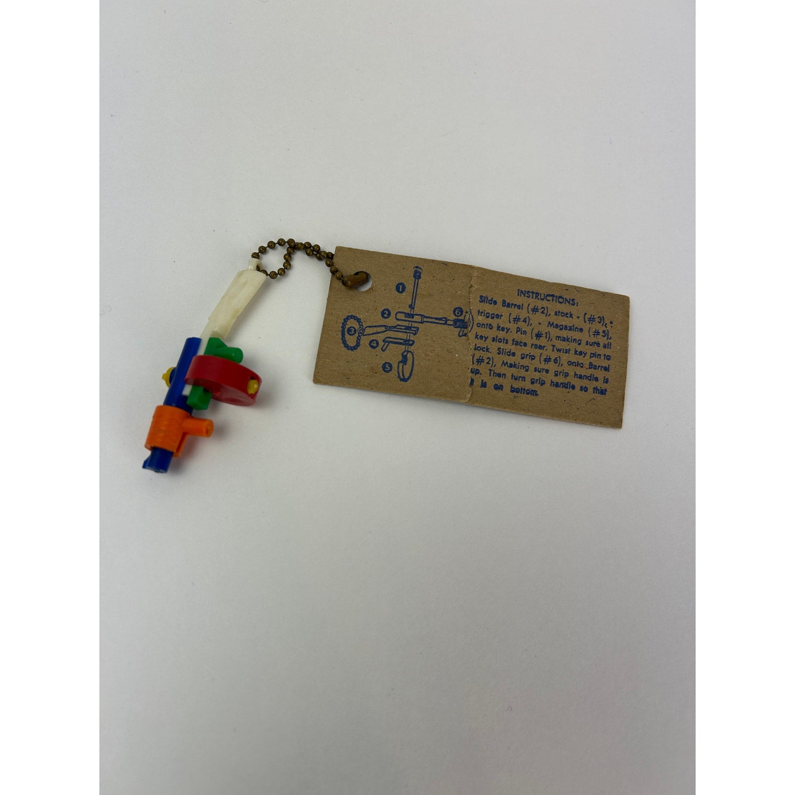 Vintage 1950s Tommy Gun Puzzle Key Chain Toy with Original 10¢ Card