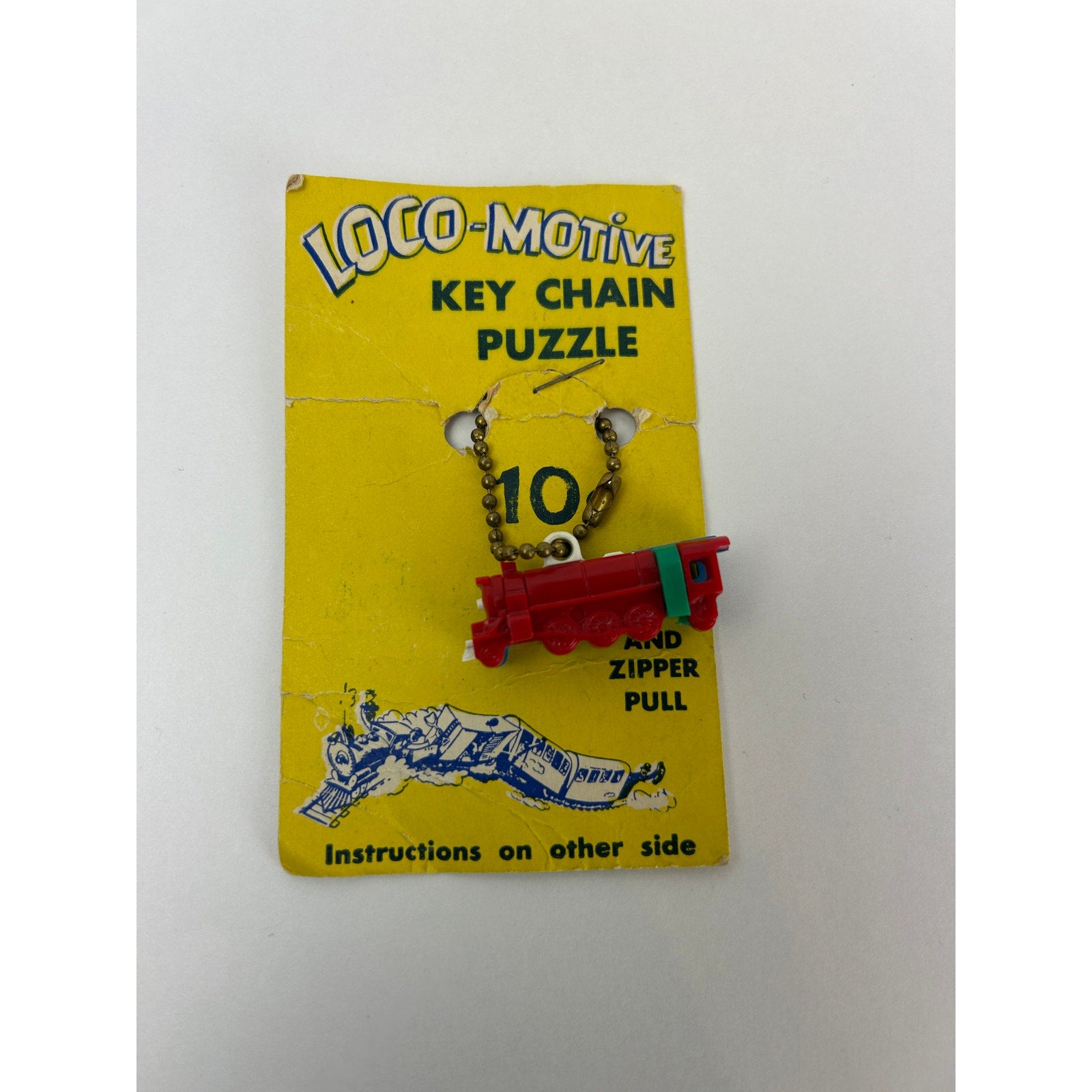 Vintage Loco-Motive Key Chain Puzzle Train 1950s Plastic Toy on Display Card
