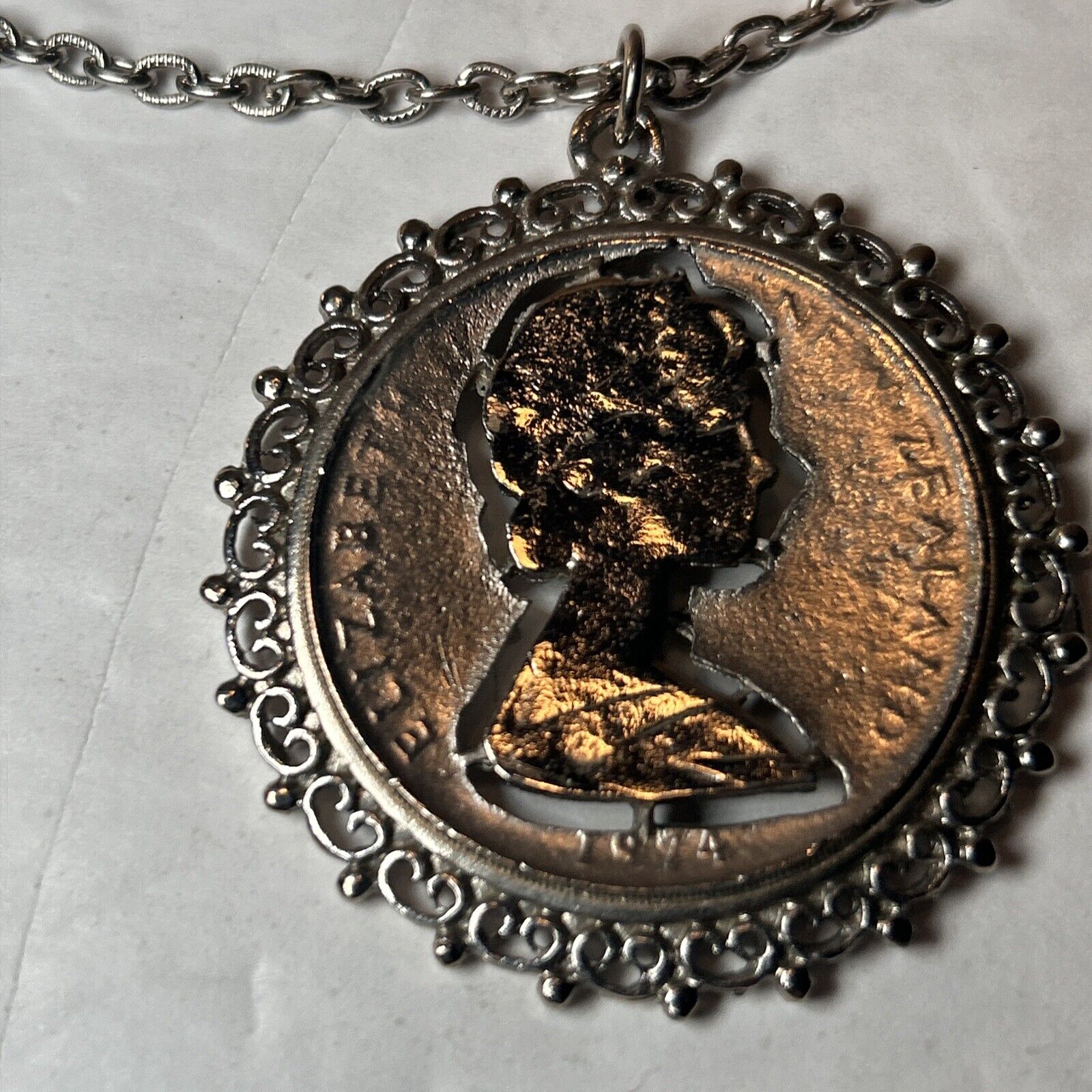 1974 Elizabeth II New Zealand framed cut coin 28" chain (315)