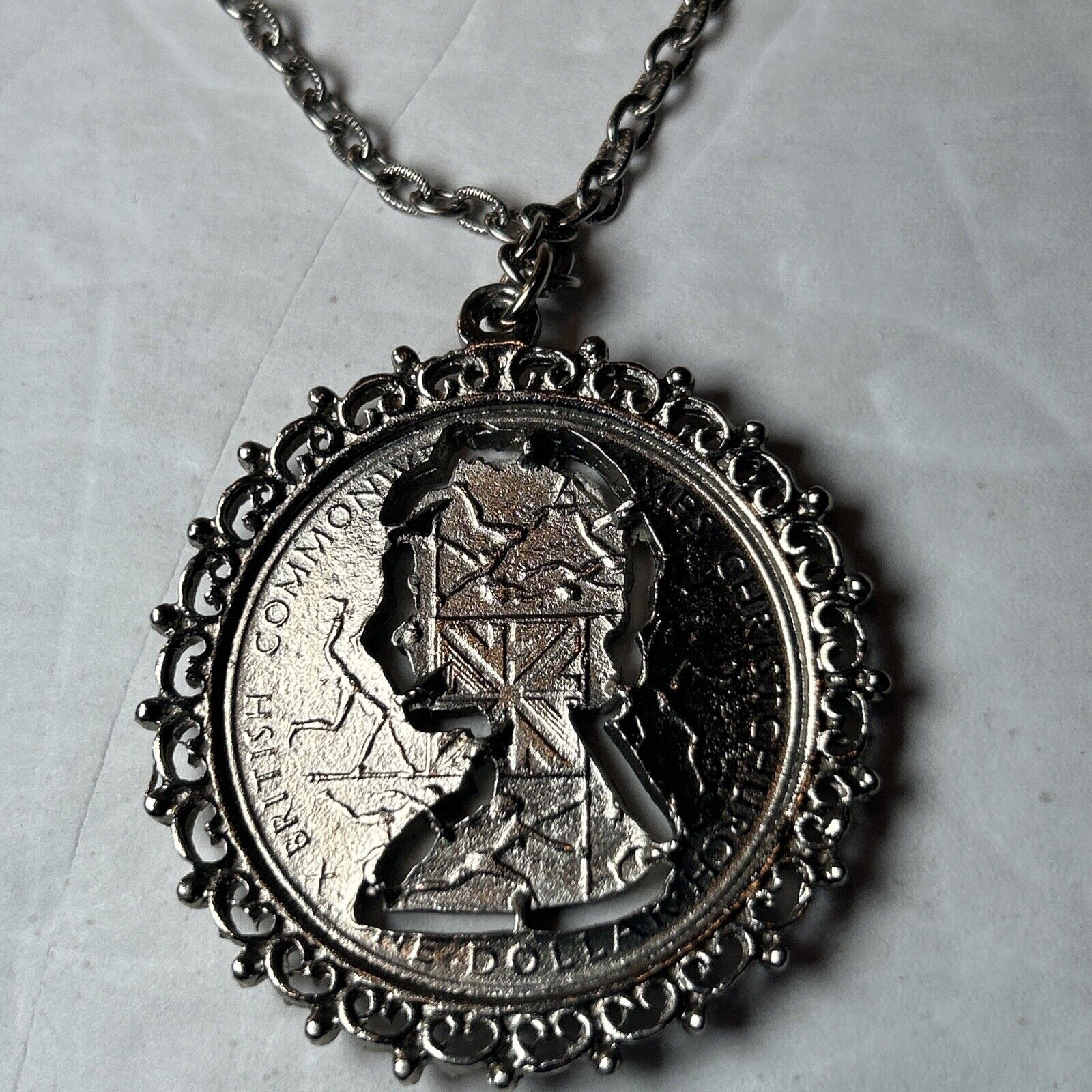 1974 Elizabeth II New Zealand framed cut coin 28" chain (315)