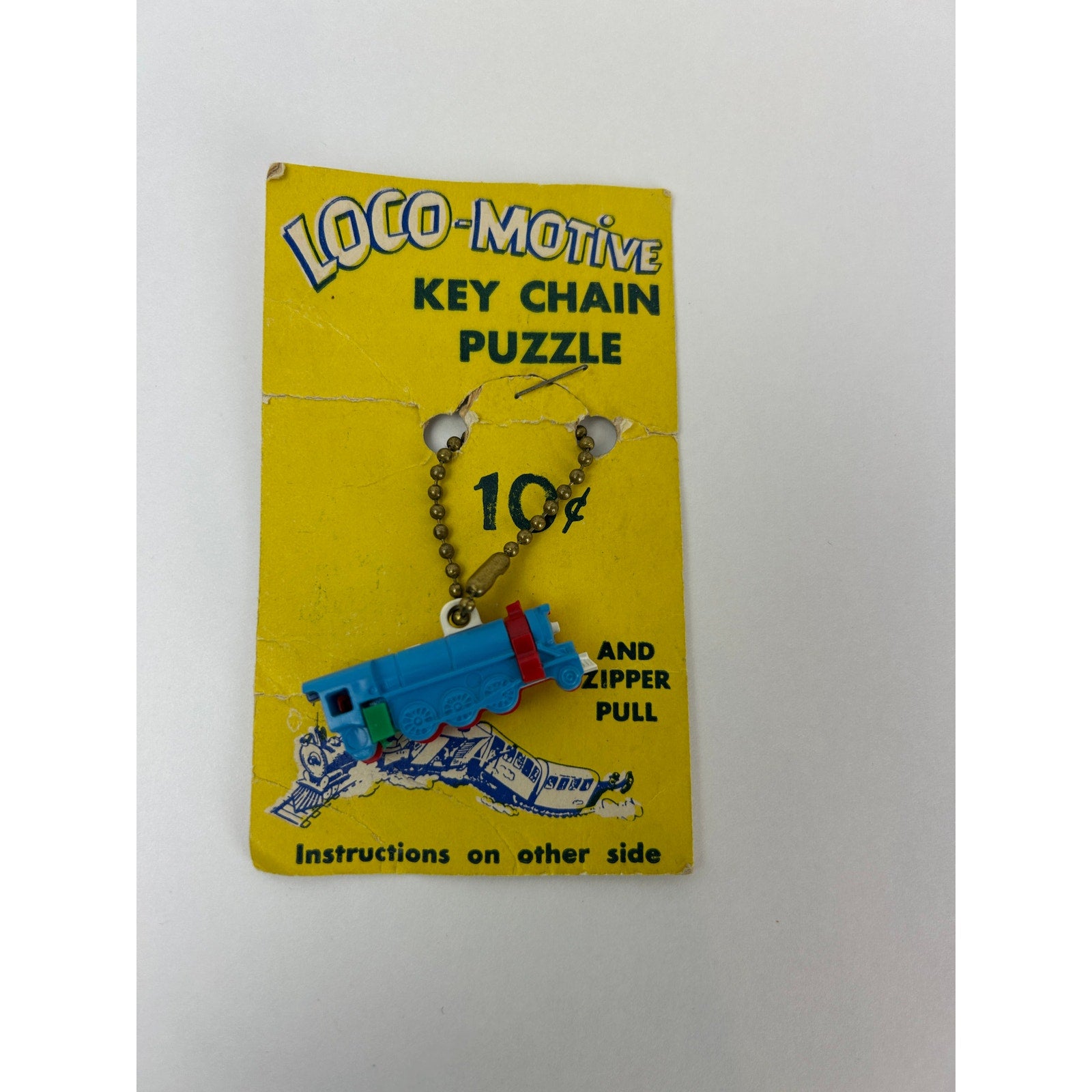 Vintage Loco-Motive Key Chain Puzzle Train 1950s Plastic Toy on Display Card