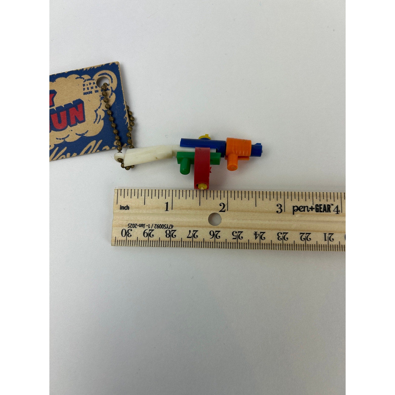 Vintage 1950s Tommy Gun Puzzle Key Chain Toy with Original 10¢ Card